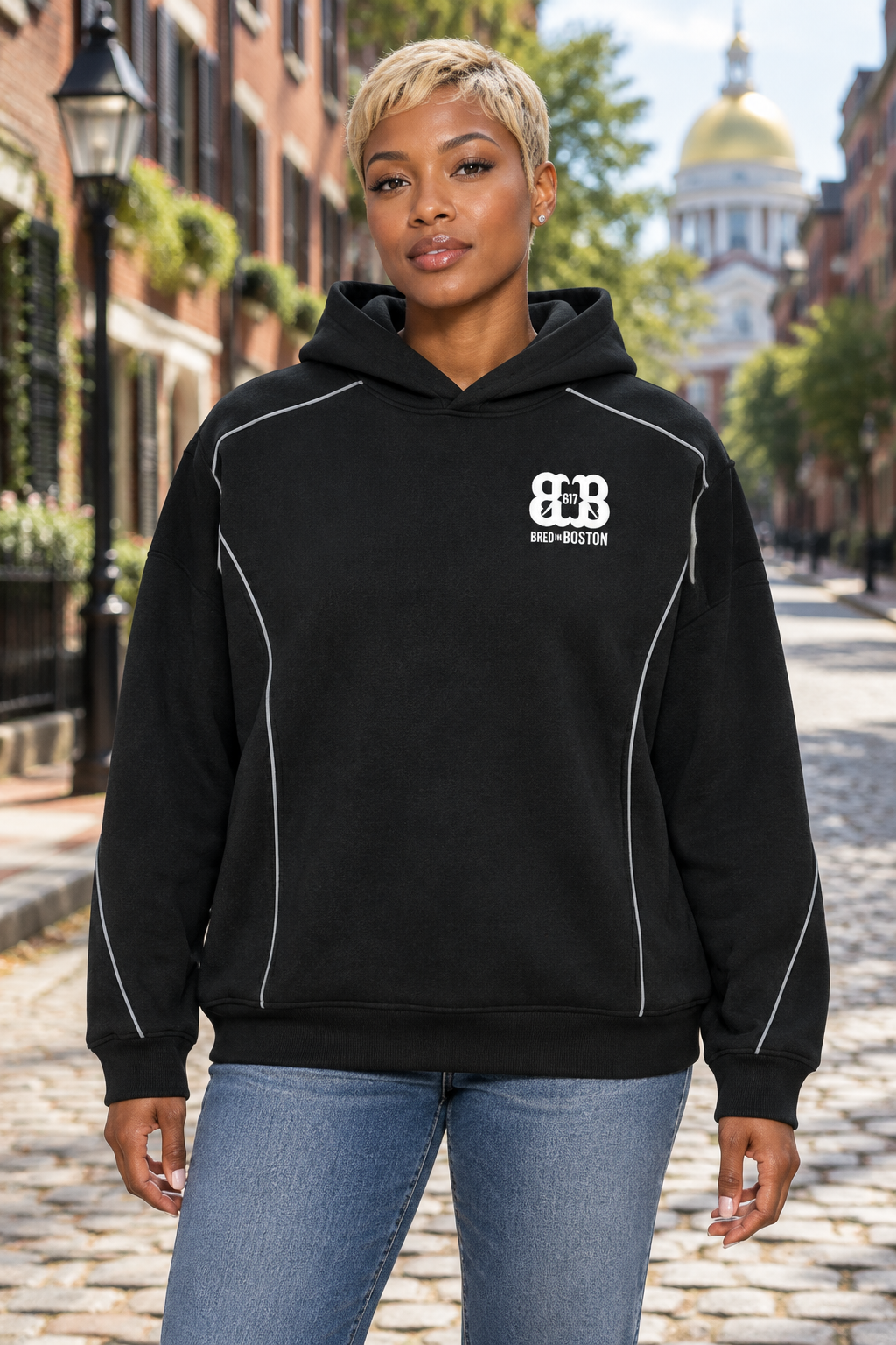 Fit African American female wearing black oversized piping hoodie