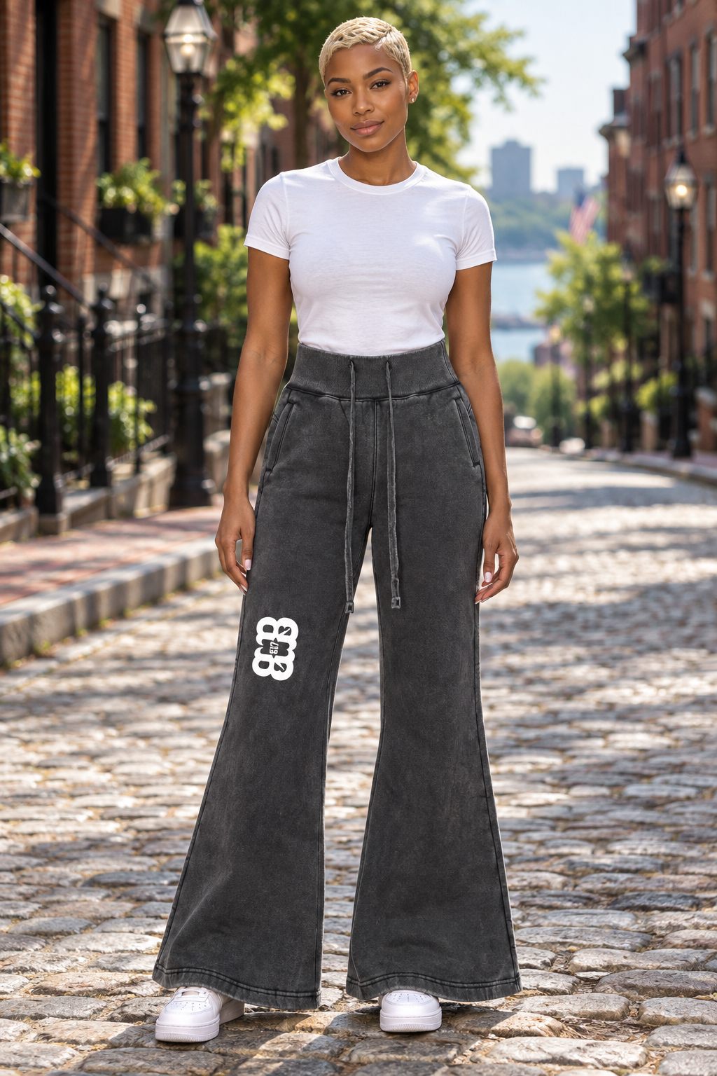 Fit African American female wearing vintage washed flared fleece pants