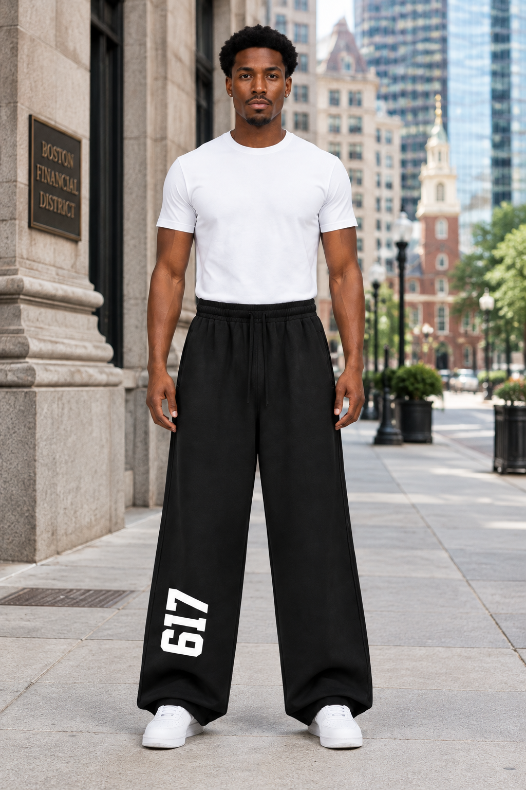 Front view of the model wearing Bred in Boston sweatpants in downtown Boston